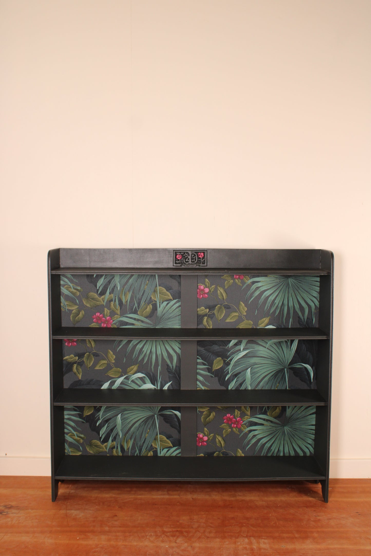Mid-Century Modern Bookshelf with Tropical Wallpaper Back